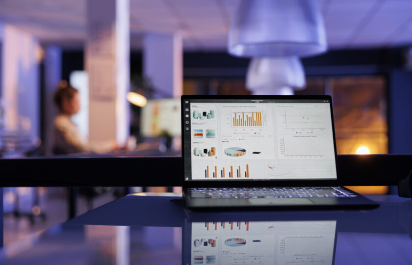 Laptop computer with company profit progress on screen